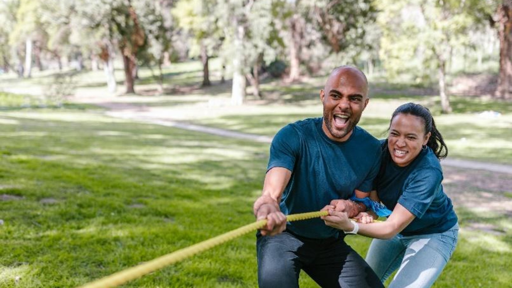 a couple exercising in a park