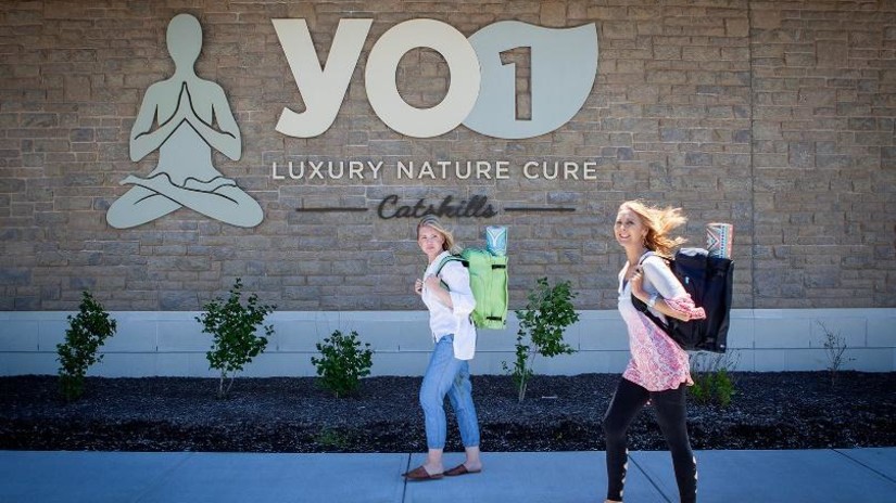 Yo1 signage in the background with 2 women walking seddr3