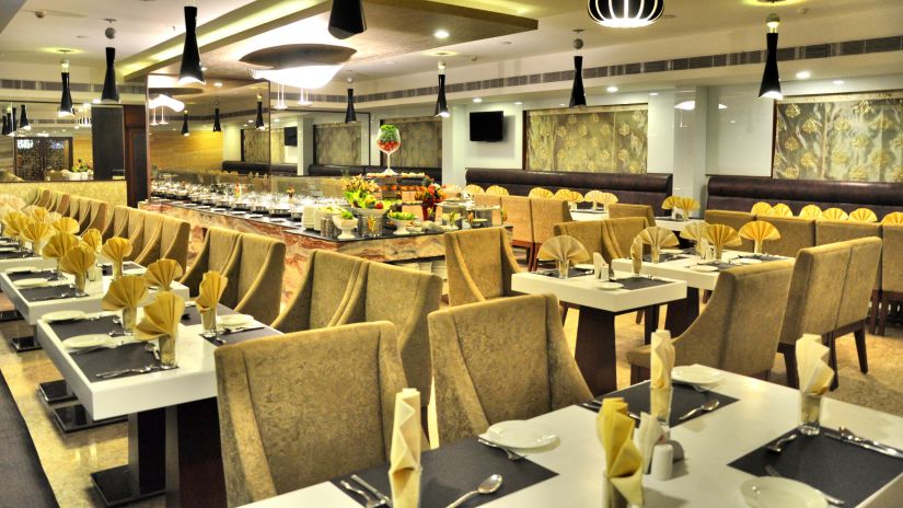 seating area at the Restaurant at Raj Park Hotel in Alwarpet, Chennai