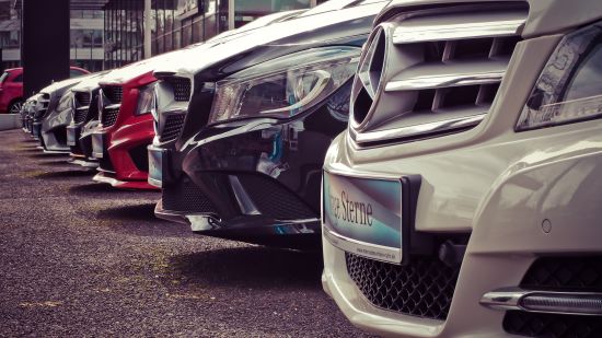 Image of multiple cars kept in a parking lot in a sequence