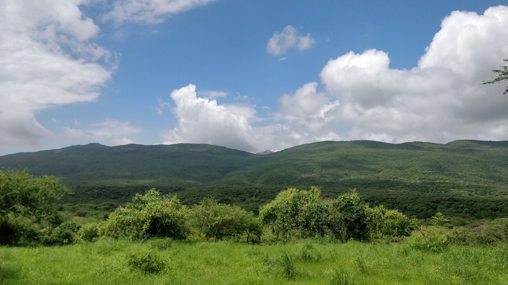 Image of hills, clouds and grassland