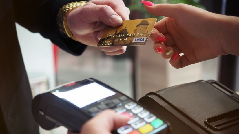 a lady holding Atm card