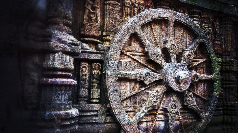 An intricately carved stone wheel on the wall of the Sun Temple at Konark, reflecting the sophistication of ancient Indian architecture.