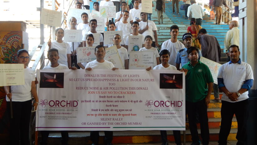 people holding an Orchid banner for Silent Rally