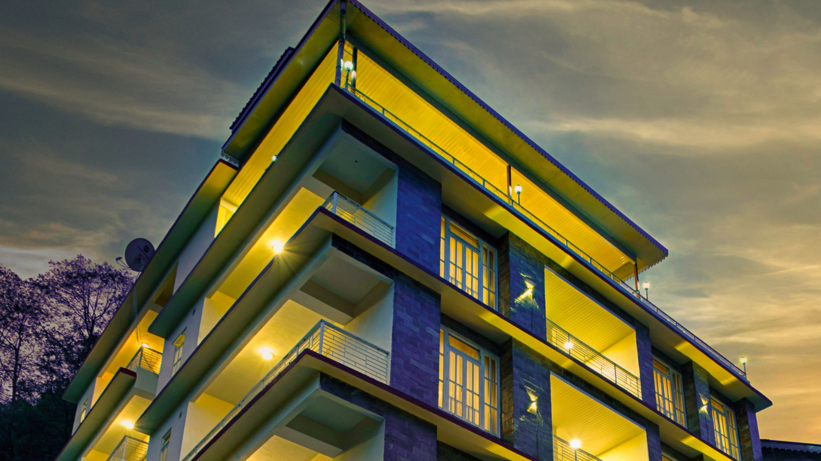 facade of a building shot from a lower angle during sunset - Voyage hotels