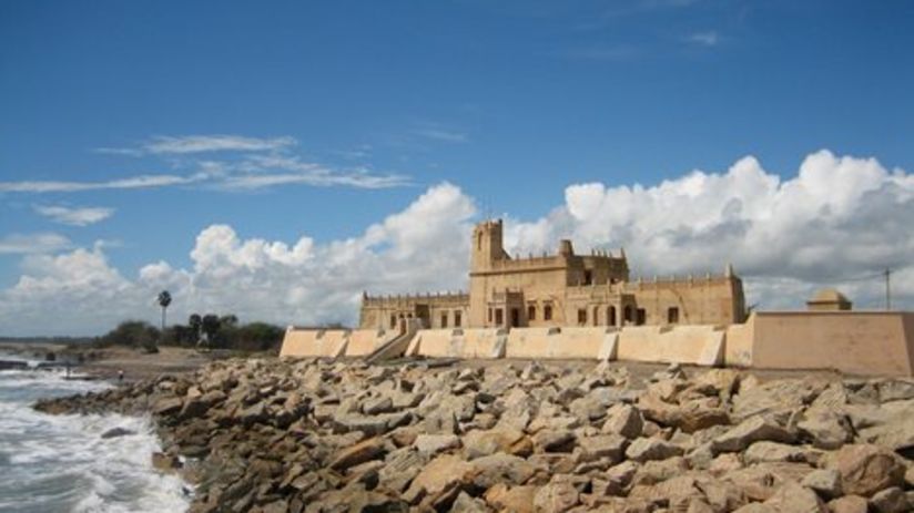 stone building on rocky seashore