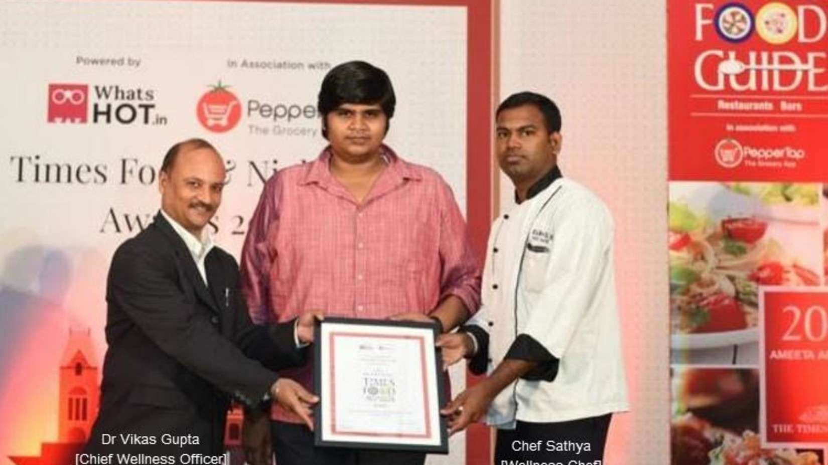 Man receiving an award at Hablis Hotel, Chennai