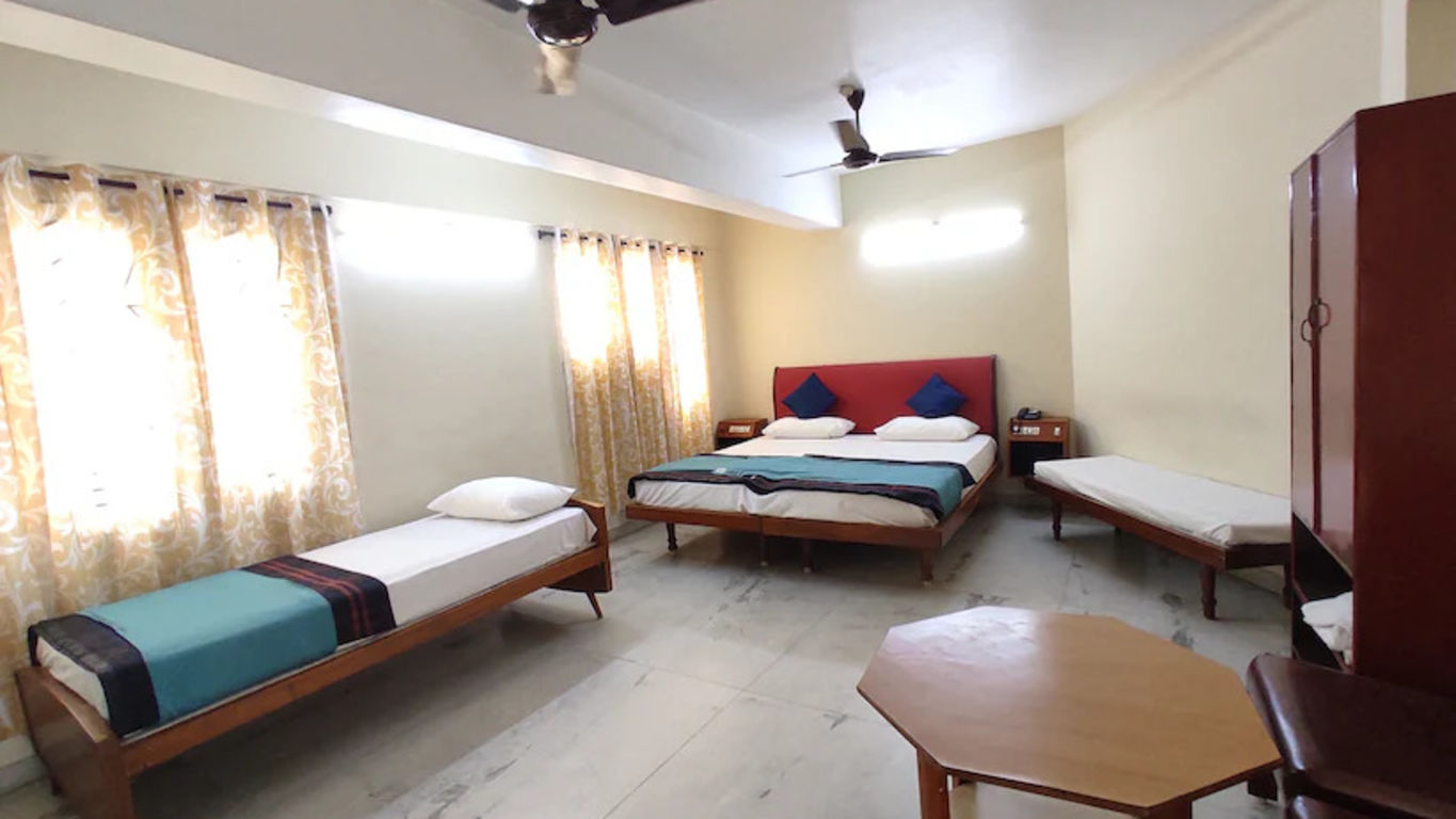 View of Triple A/C room with king size bed and single bed, which has plenty of space for relaxing stay - Hotel Ram International,  Pondicherry