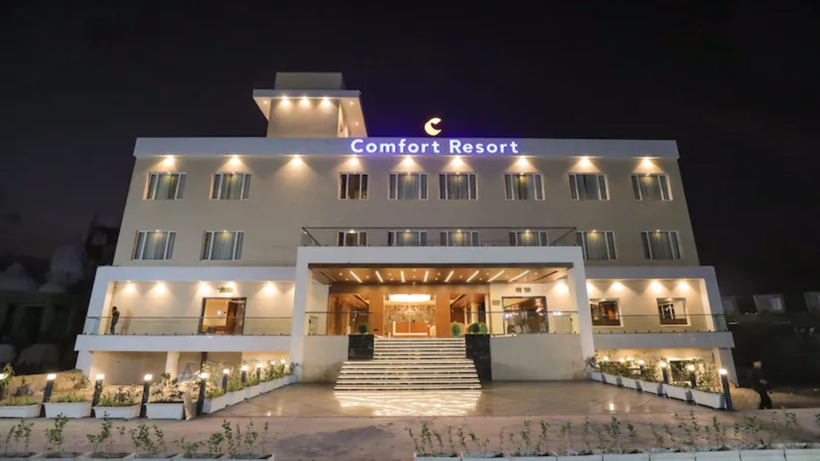 Facade image of Comfort Resort, Morbi captured during the night