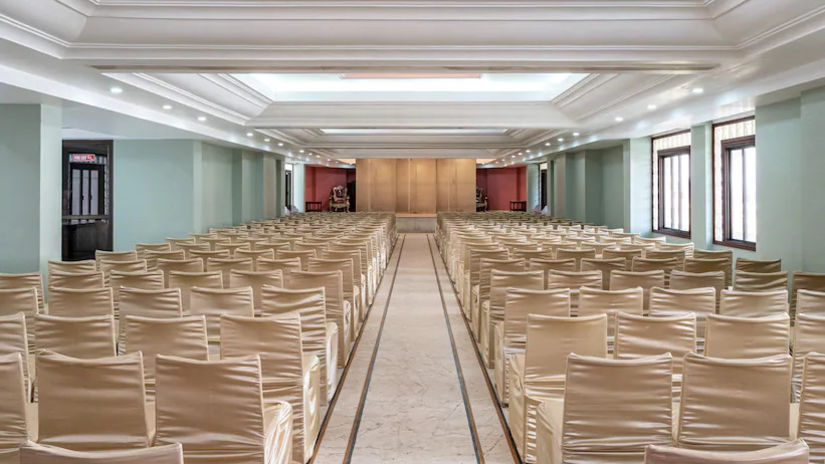 Back view of Banquet Hall with multiple chairs and modern interior - Hotel Ram International, Pondicherry