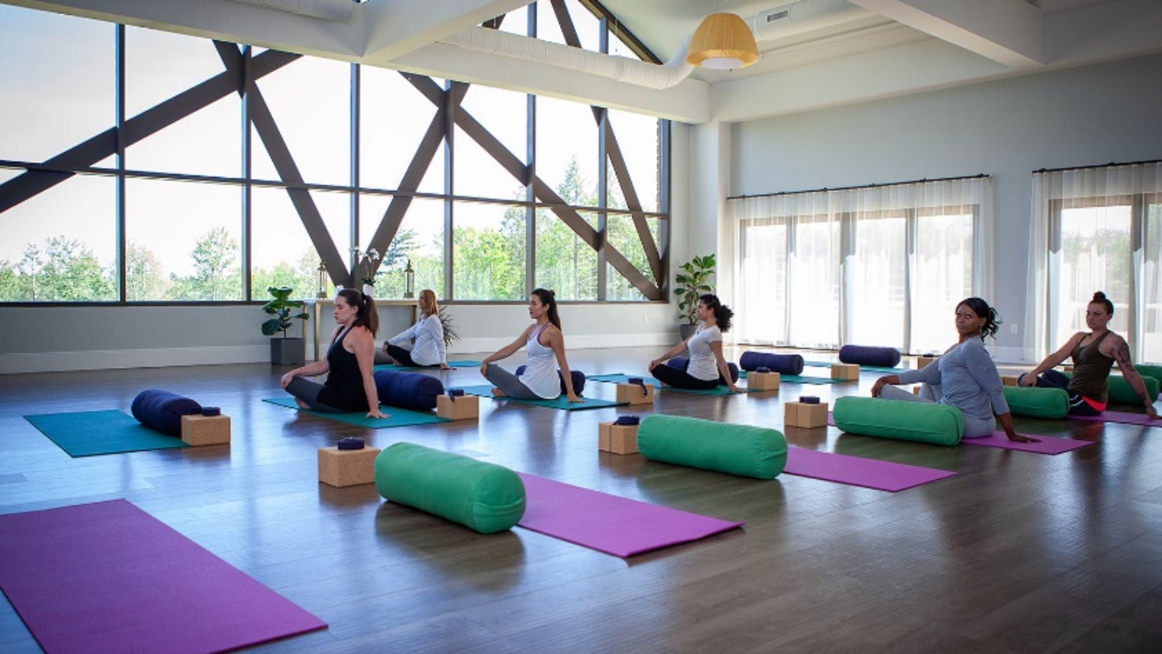 a group of people meditating in a room