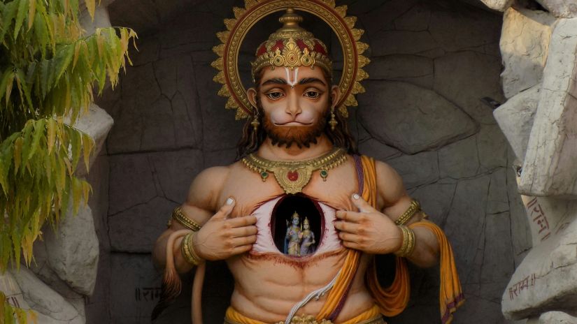 an idol of hanuman tearing his chest to show Ram & Sita 