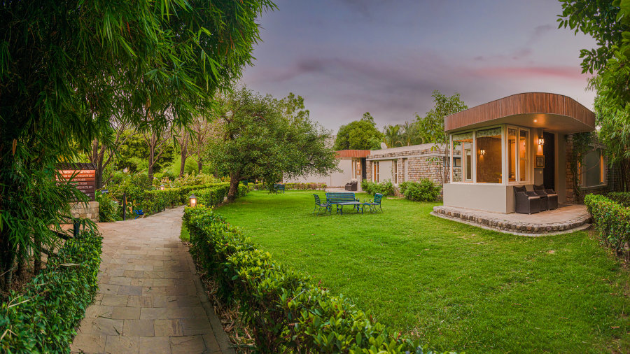 Outdoor View of the Villa with the garden in the foreground - The Golden Tusk