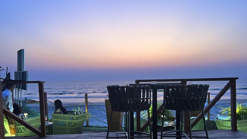 Openair restaurant by the seas side at dusk