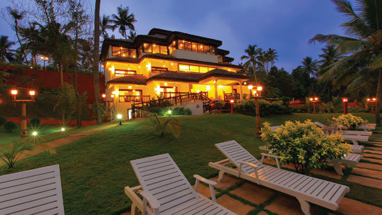 Well lit facade of hotel Fragrant Nature Kollam