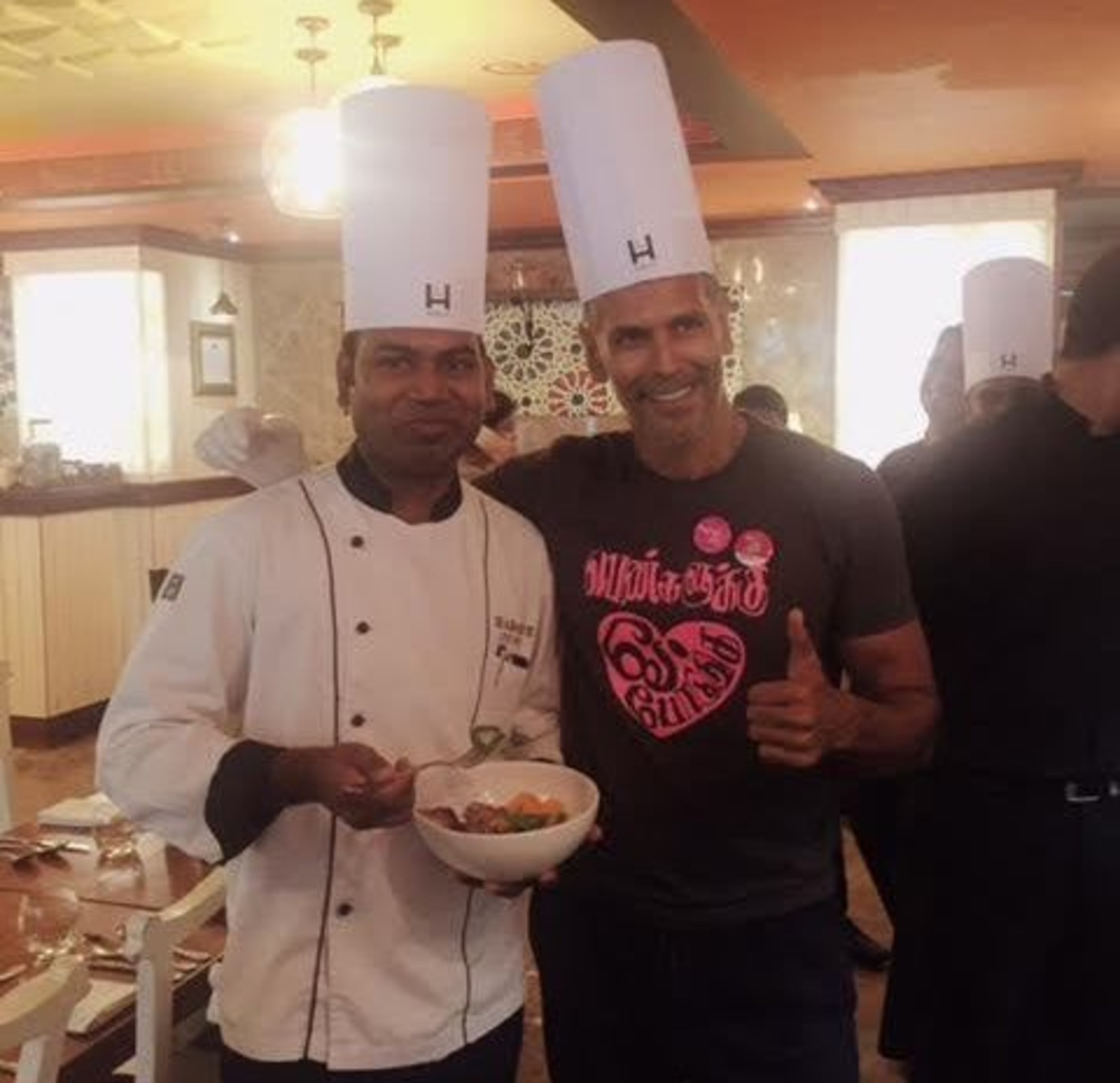 Chef Sathya and Milind Soman posing for a picture at Hablis Hotel, Chennai