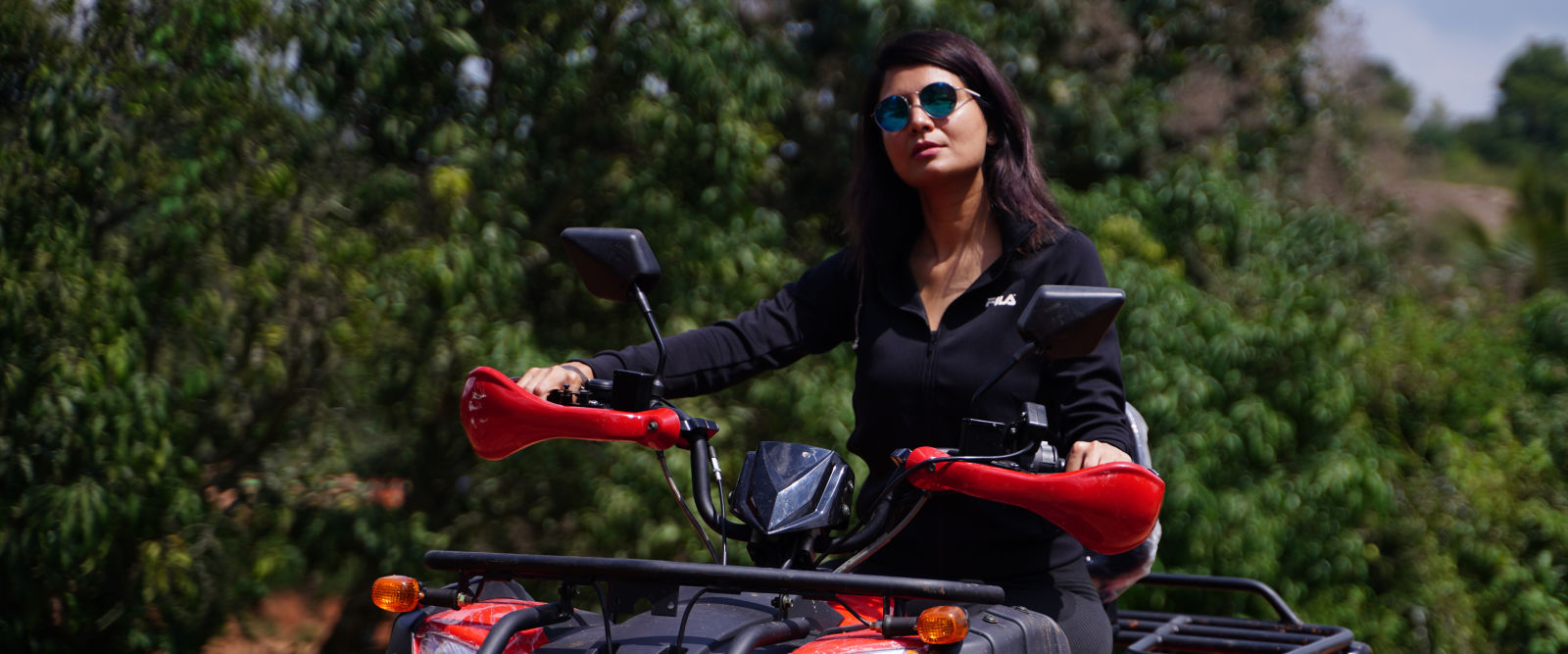 Ravishing Retreat Ramanagara - A guest riding the atv bike at our resort