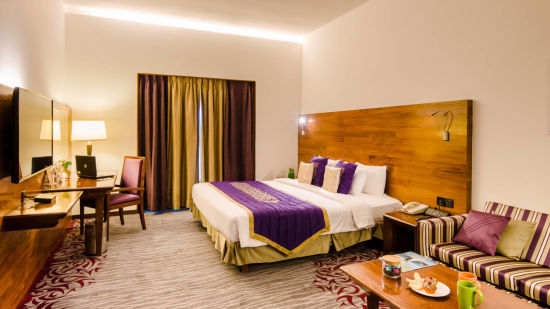 premier room with bed view and amenities  - The Orchid Hotel Pune