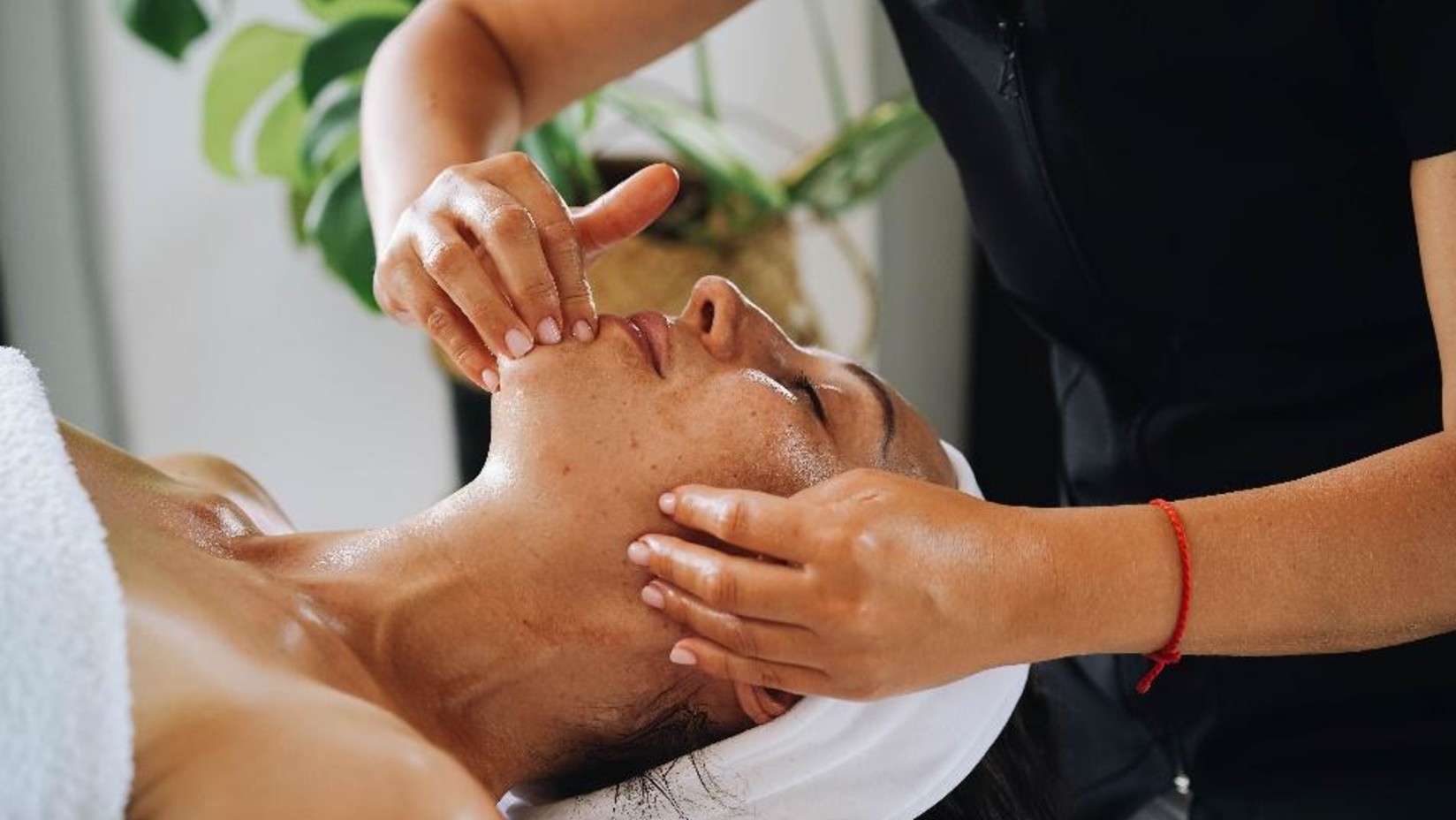 A person getting a face scrub