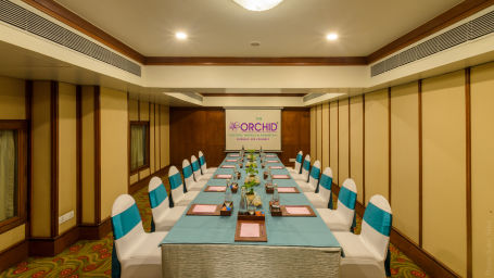 Stylish conference room with teal and white decor at The Orchid Hotel Mumbai Vile Parle