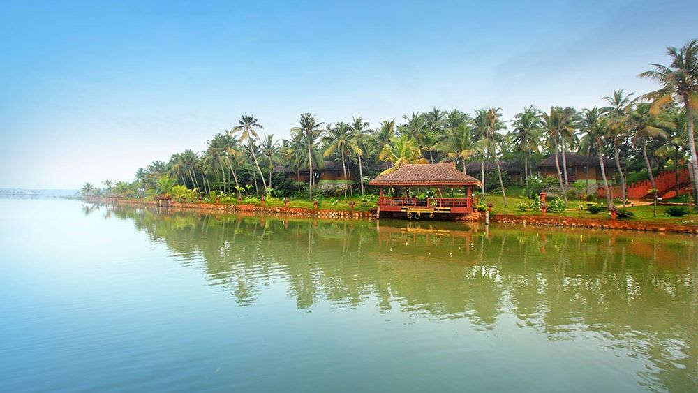 view of Fragrant Nature Kollam from across a lake