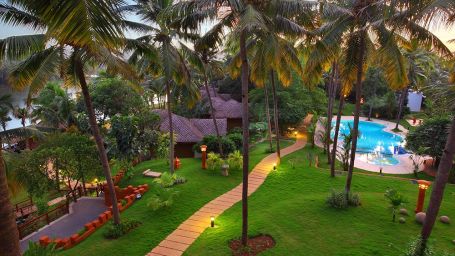 aerial view of hotel Fragrant Nature Kollam surrounded by coconut trees