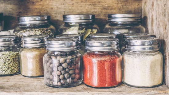 jars containing assorted condiments and spices