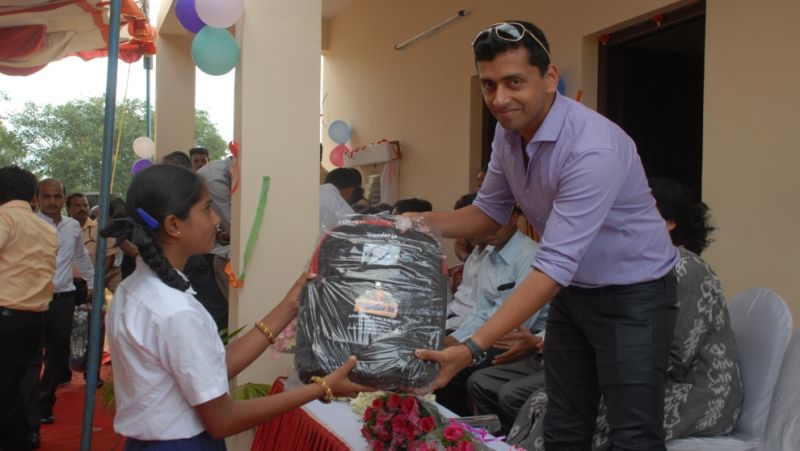 Student being gifted schoolbag