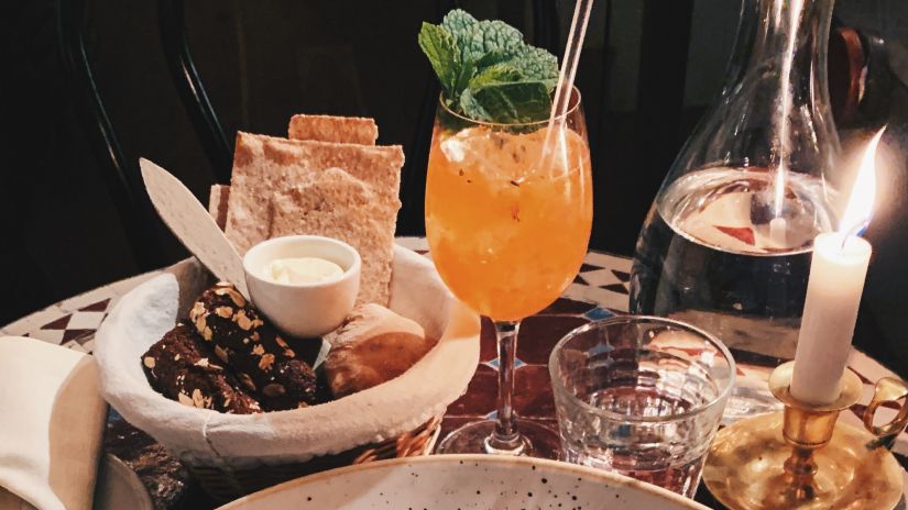 A dinner spread on a table with a candlelight