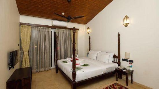 bedroom with curatins and cupboard - Mastiff Grand La Villae Resort, Lonavala
