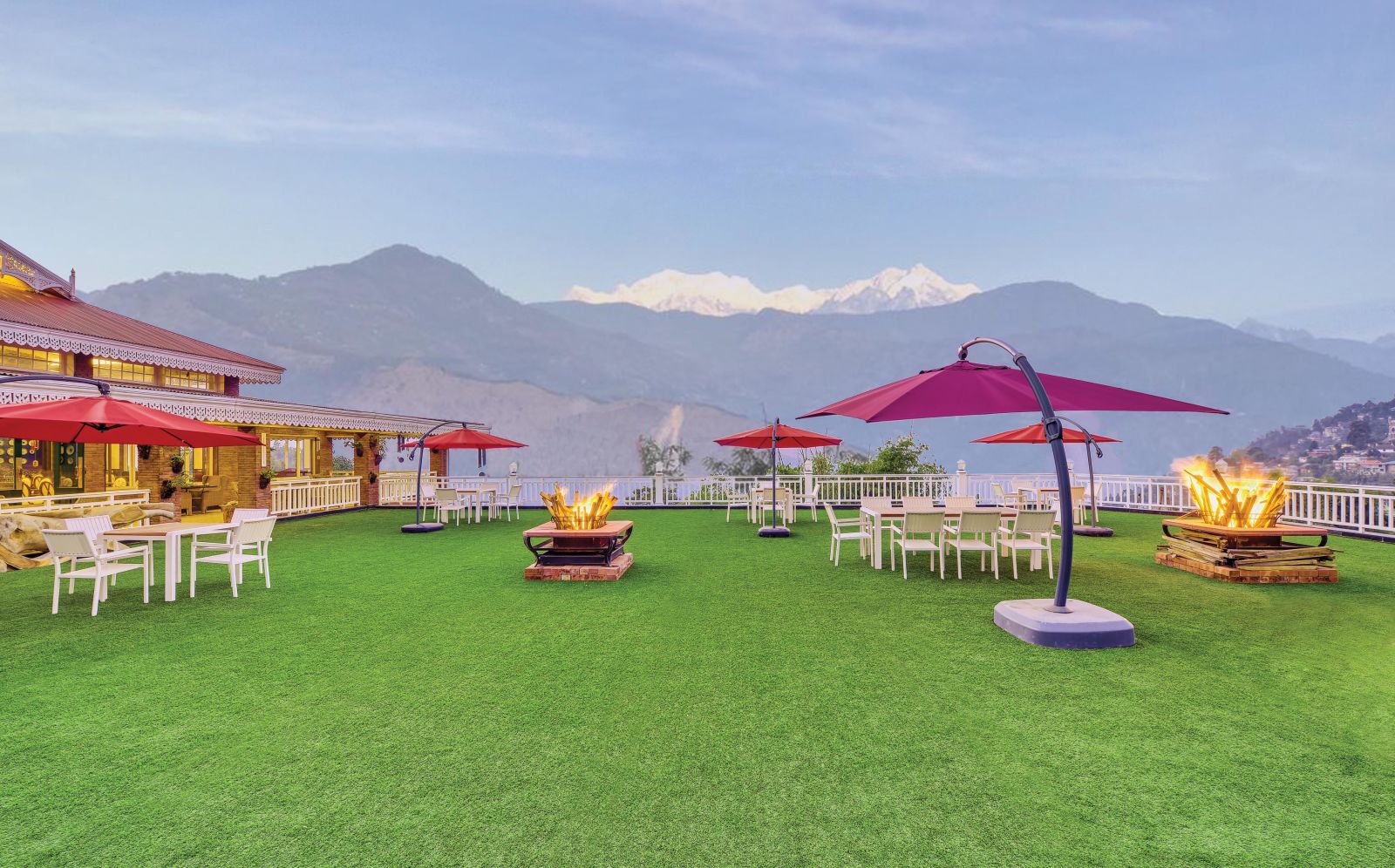 seating spaces at the lawn overlooking the snow-capped mountains in the background - Mayfair Himalayan Spa Resort Kalimpong