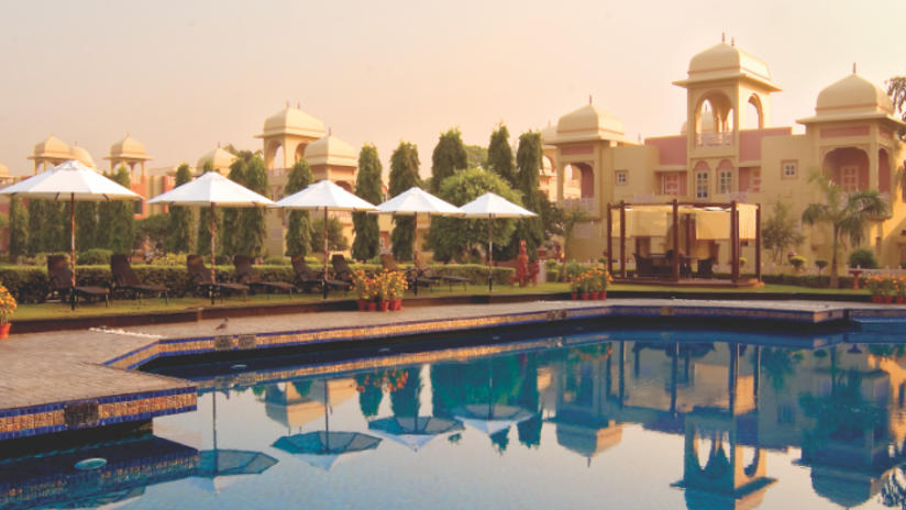 Pool near the facade of heritage village resort and spa