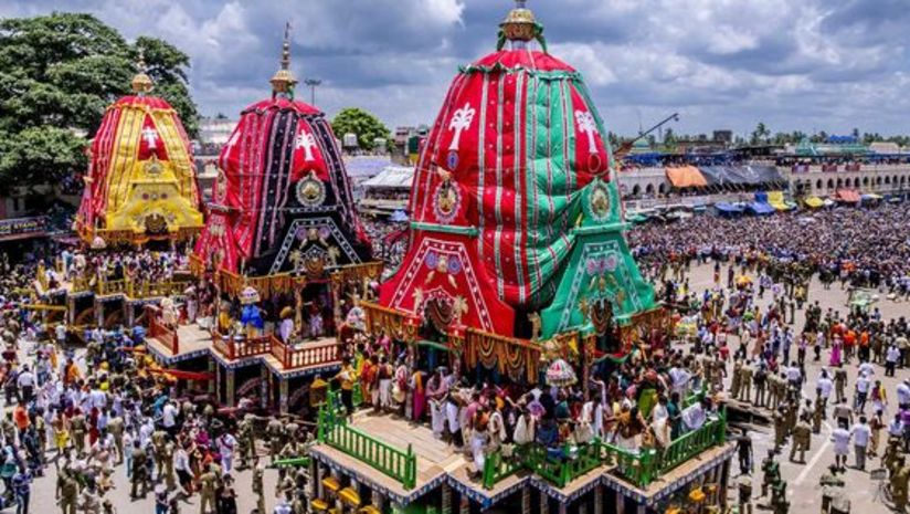 Rath yatra with a large group of people standing in front of a crowd