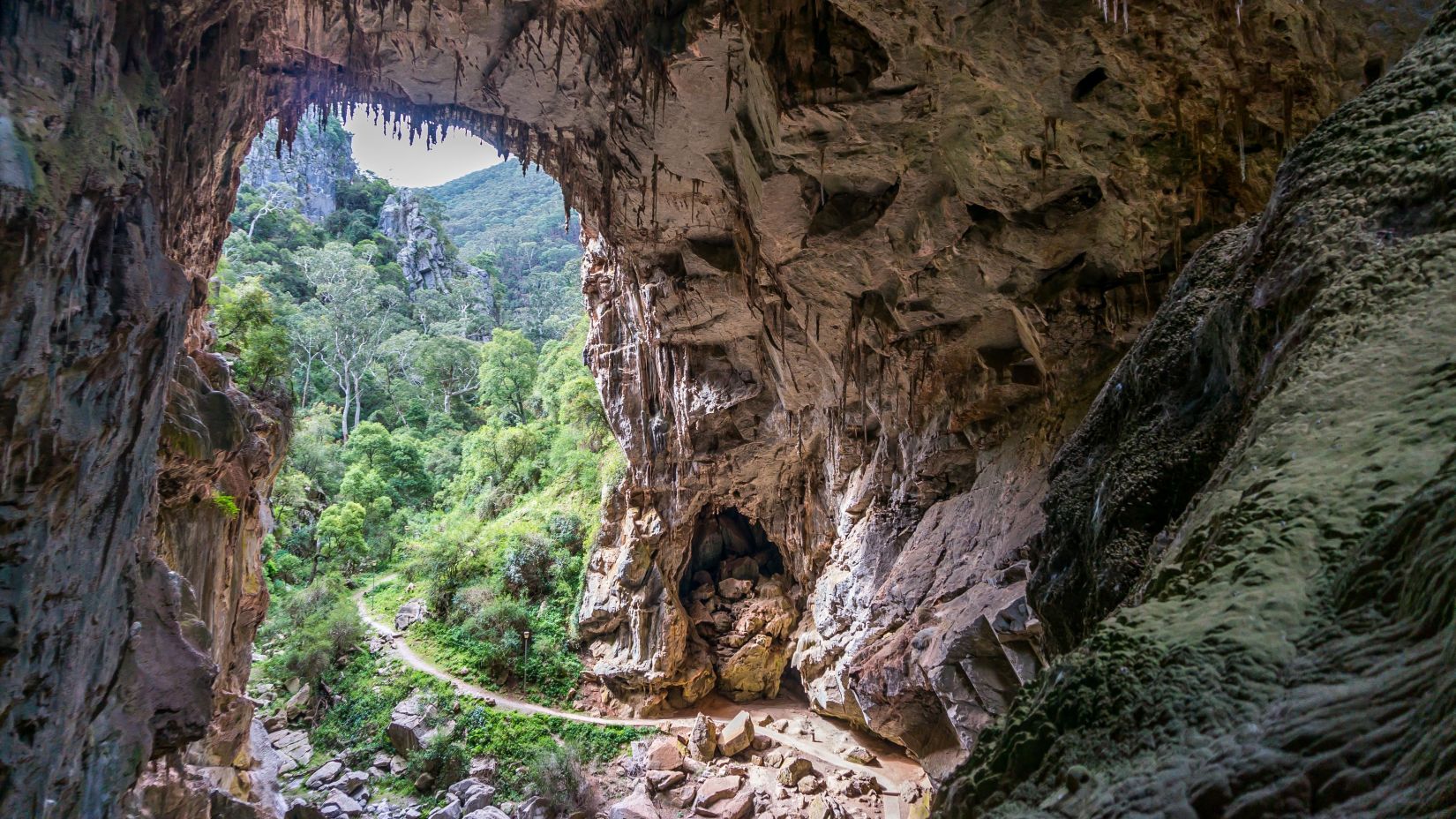 trekking path with a rock arch