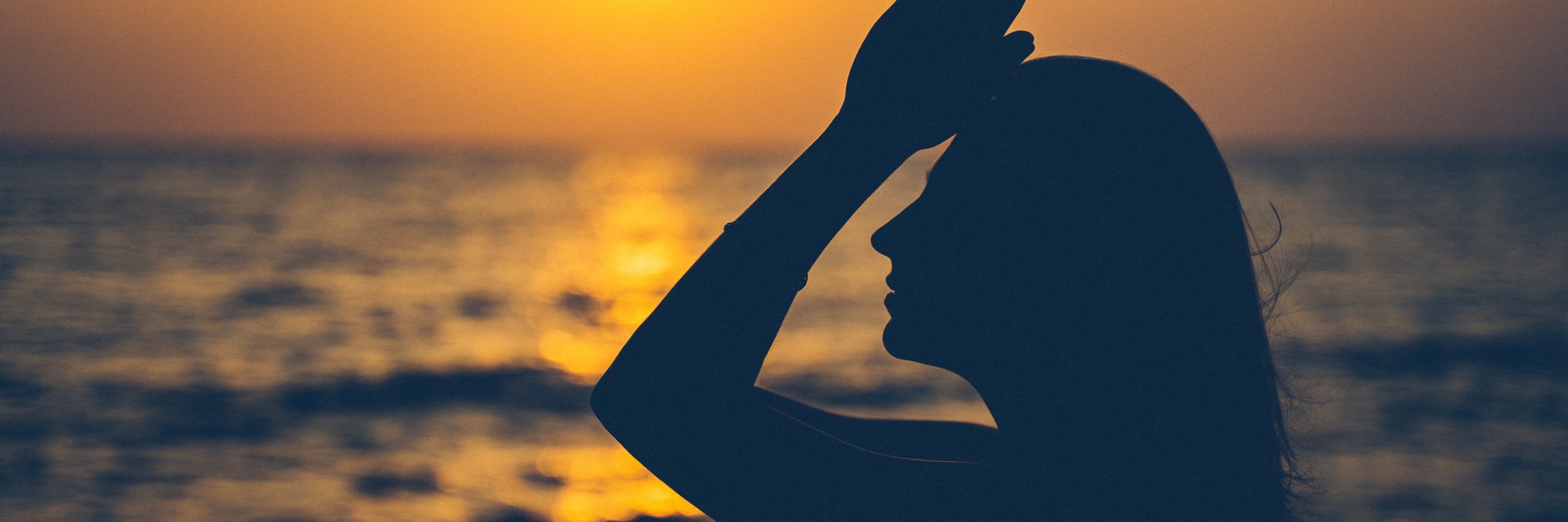 a woman  doing beachside yoga in Goa