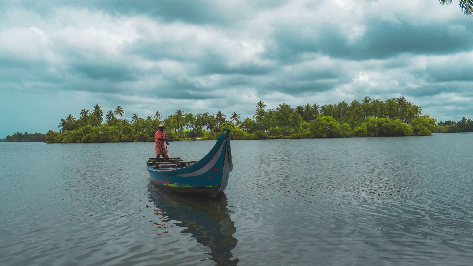 a boat on the Vembanad lake to reach Kumarakom from Alleppey