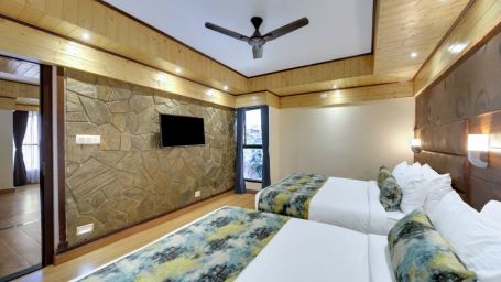 Premium Family room with two large beds with a television  - Sumi Queensyard, Darjeeling