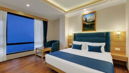 Double bed in the premium room at Yashshree Sikkim Blossom