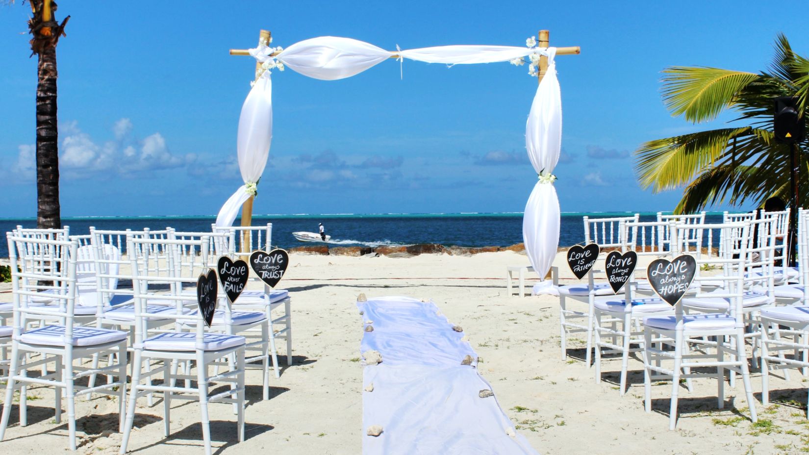 Beach wedding with decorations and seating