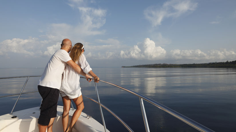 people looking out at sea from a boat