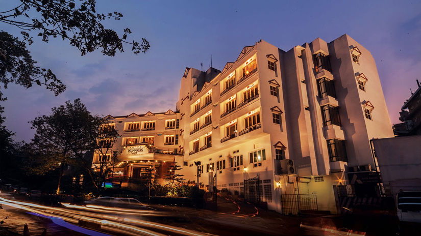 the exterior facade of Polo Towers hotel in Shillong with the evening sky in the background