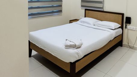 a double bed in one of our rooms in Secunderabad