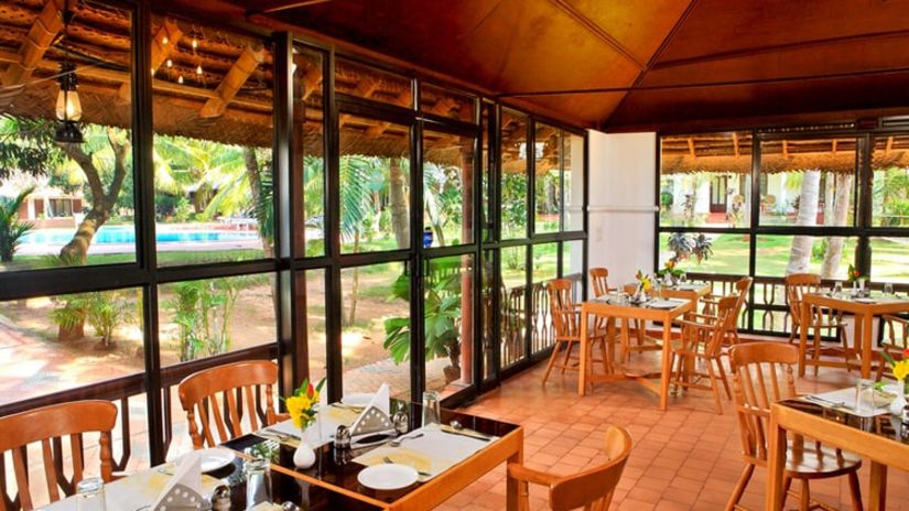 Seating arrangements inside the restaurant - Abad Harmonia, Kovalam