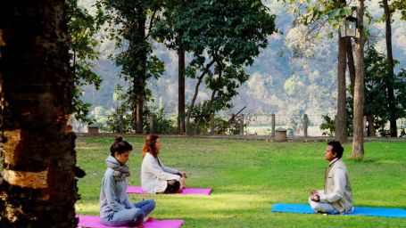 yoga therapy with two clients and a yoga instructor