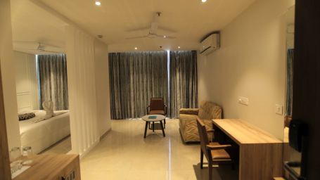 Suite at Hotel Mumbai House Express, Udaipur with a bedroom and a separate living room