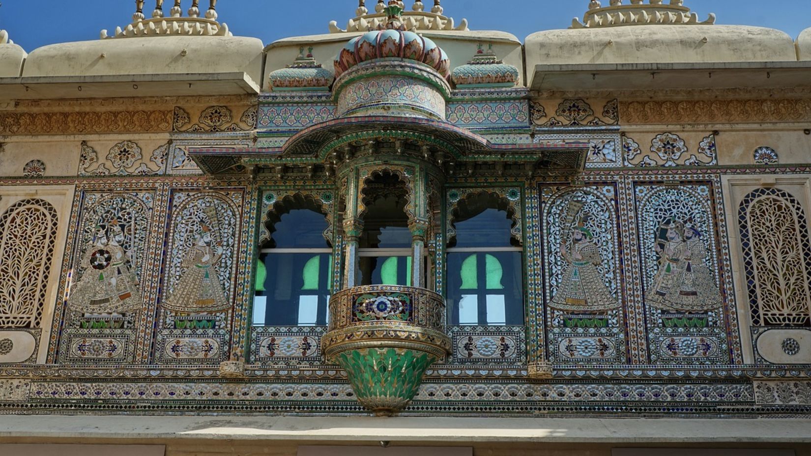 Udaipur's classic architecture is on display on a typical Rajasthani balcony that is elaborately embellished with complex carvings and vivid colours - Udaipur