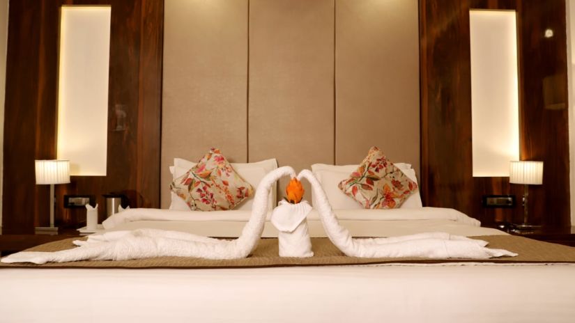 towels decorated as a swan on the double bed inside the suite at 5 flowers ananta elite, kota