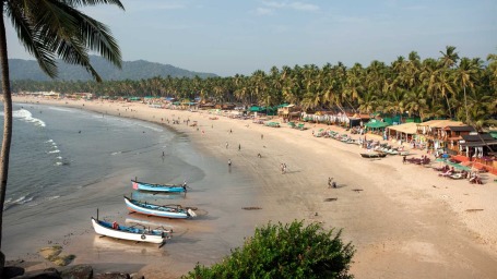 Goa beach with a few boats docked in the sand - Villa in Palms by V Escapes