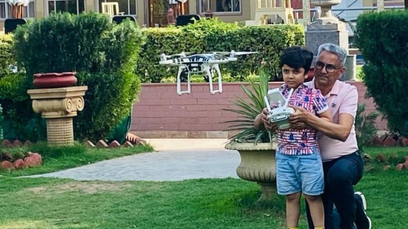 Grandfather-grandson using a drone