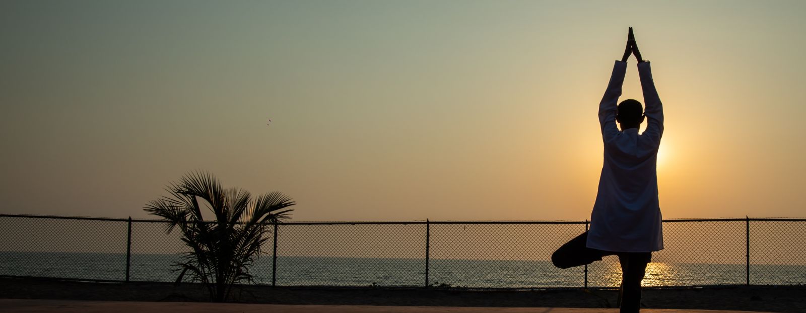 sihouette of a person practising yoga